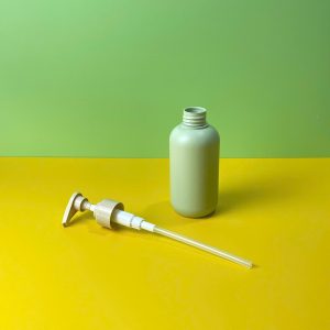Chai HDPE tròn xanh vòi nhấn sóng nâu trơn