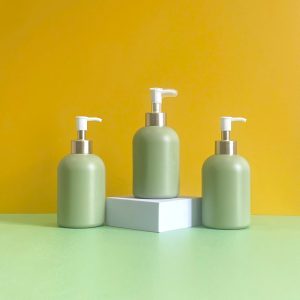 Chai HDPE xanh lá tròn lùn vòi nhấn kẹp trắng